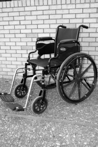 Black & White wheelchair against a wall